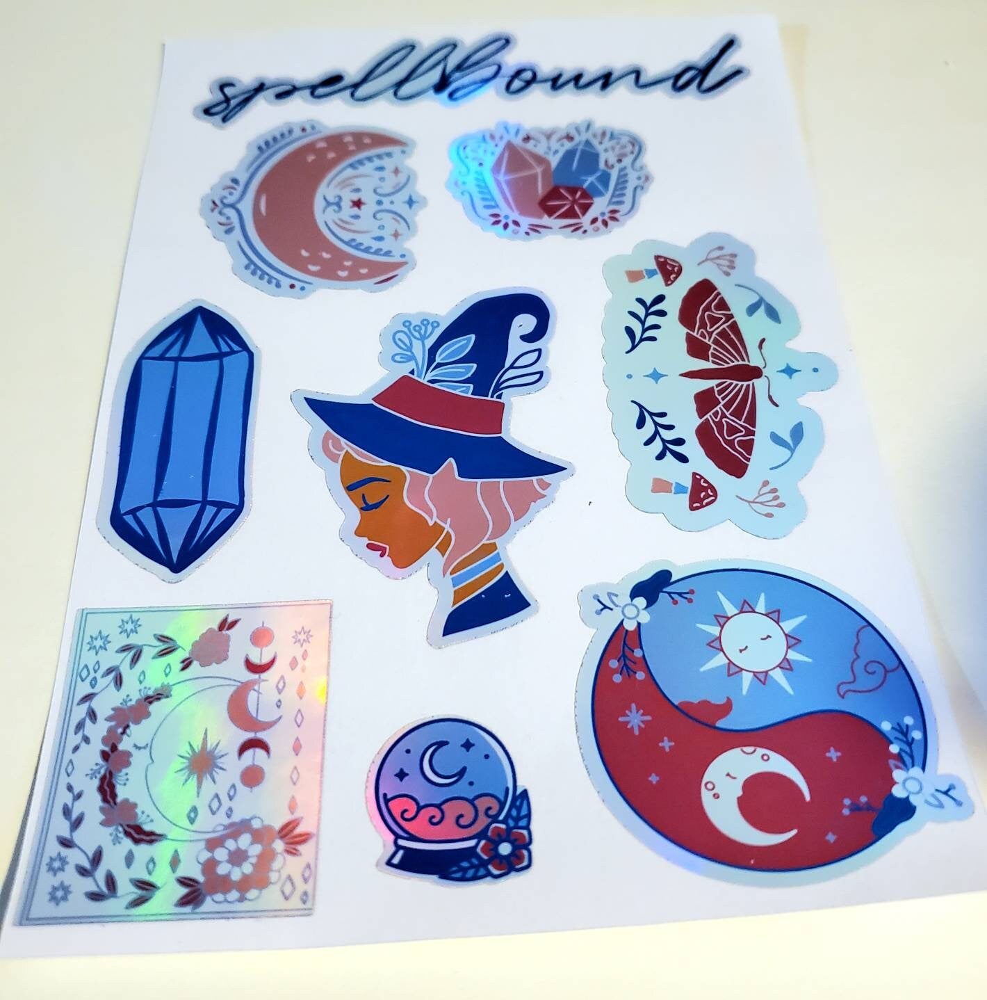 Holographic Spellbound Sticker Sheet - Waterproof 4.25" x 7.25" - witch magic moon crystals moth mushrooms sun Luna celestial