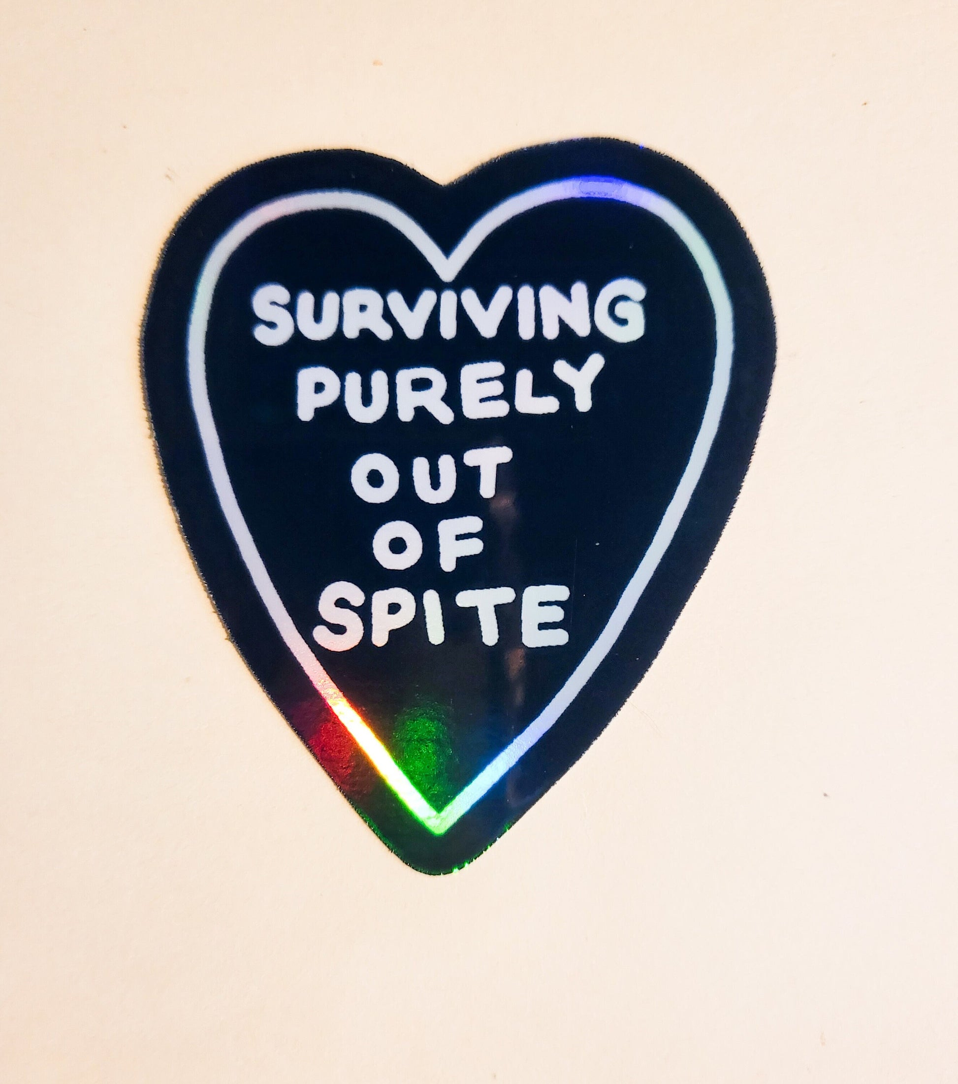 Surviving Purely Out of Spite Sticker - Holographic 2.4" x 2.8"- stickers decal funny humor heart black